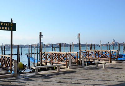 Gondolas docking on the canals bank in venice, italy