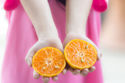 Low section of person with fruits