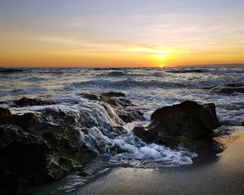 Scenic view of sea against sky during sunset