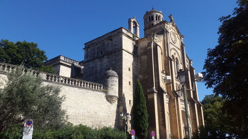 Low angle view of building against clear blue sky