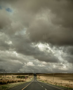 Storm clouds over road