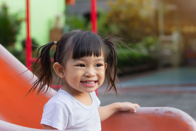 Cute girl smiling girl at playground