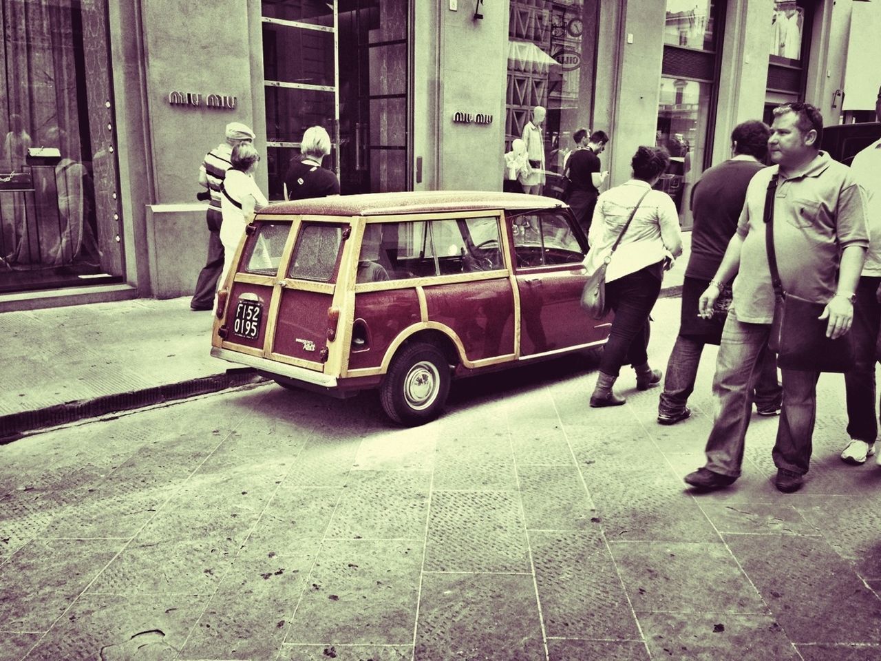 building exterior, transportation, architecture, men, street, built structure, land vehicle, lifestyles, mode of transport, full length, city, walking, city life, leisure activity, person, car, rear view, casual clothing