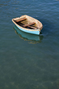 High angle view of abandoned boat moored in water