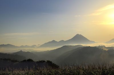 Scenic view of mountains against sky during sunset