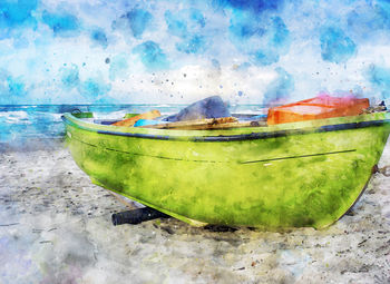 Close-up of fishing boat on sea shore against sky