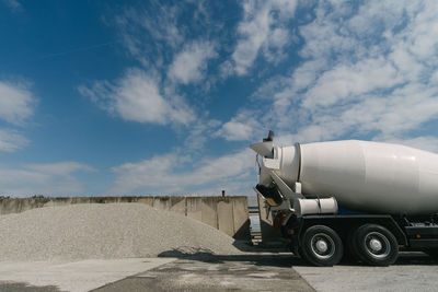 Vehicles on road against the sky