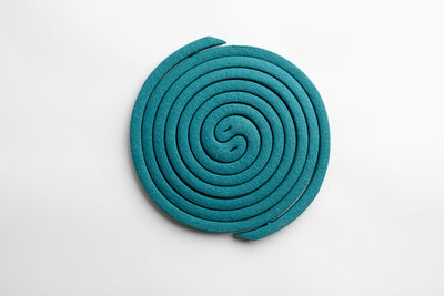 Directly above shot of spiral pattern on white background