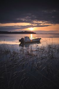 Scenic view of sea against sunset sky