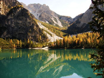 Scenic view of lake and mountains against sky