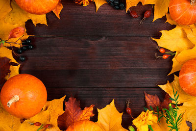 Close-up of autumn leaves on table