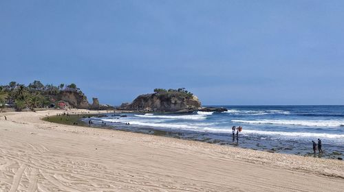 Scenic view of sea against clear blue sky