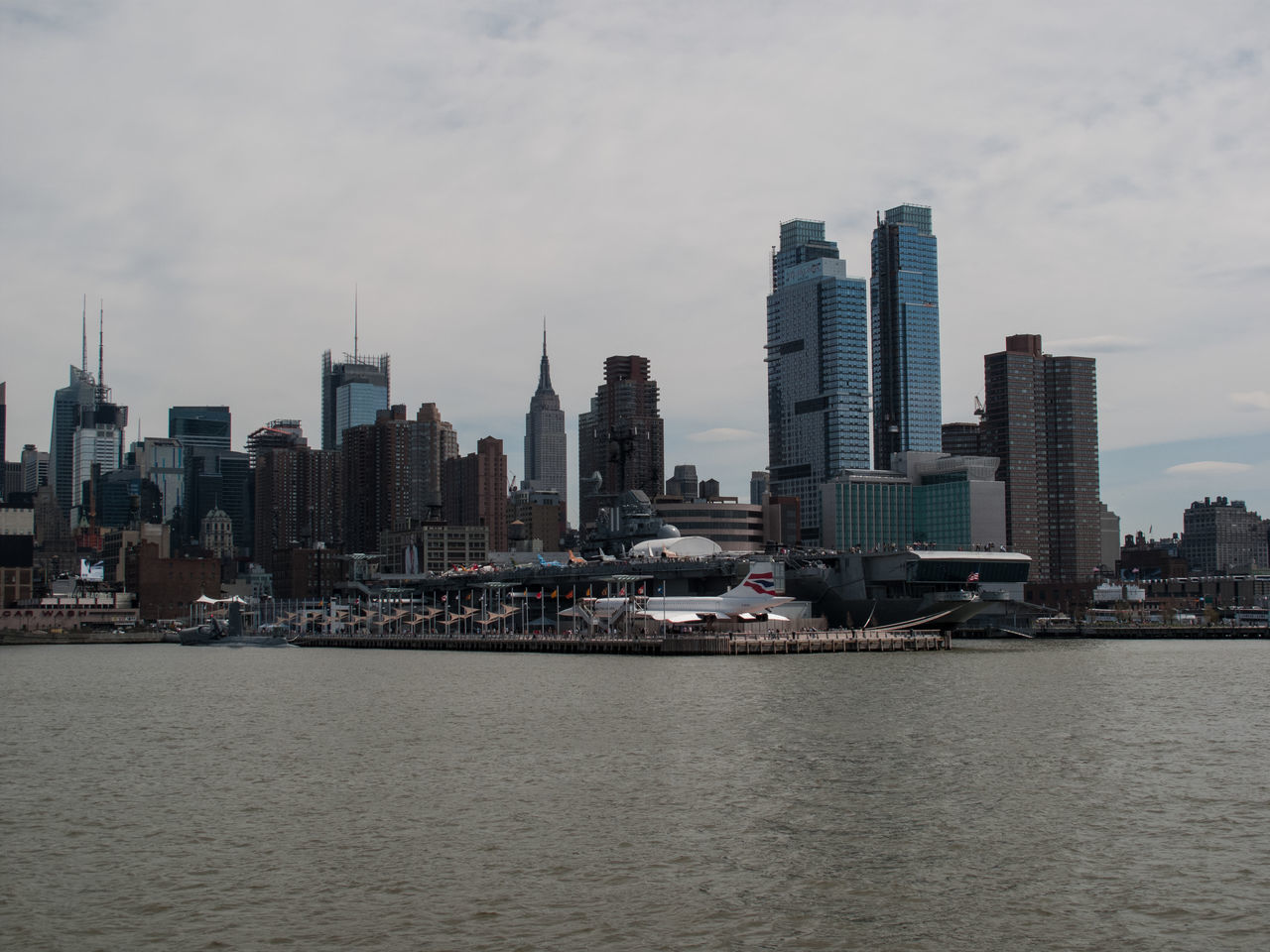 VIEW OF SKYSCRAPERS AT WATERFRONT