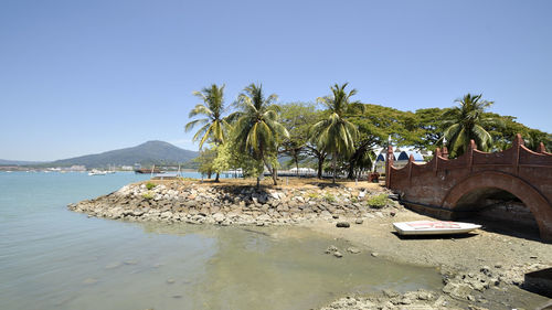 Scenic view of sea against clear blue sky