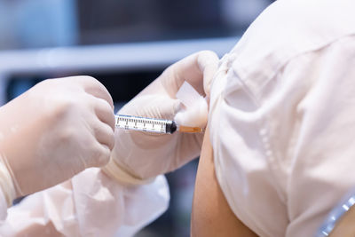 Midsection of person holding umbrella