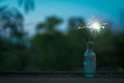 Close-up of illuminated light on table