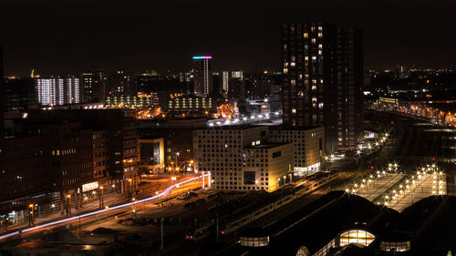 High angle view of illuminated buildings in city at night