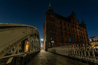 View of bridge in city at night