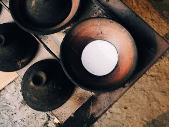 High angle view of surabi cooked upon small earthenware frying pan