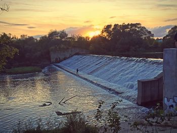 Scenic view of sunset over river