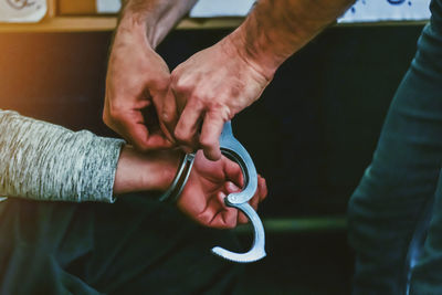 Close-up of man holding hands