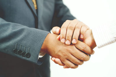 Close-up of business people stacking hands