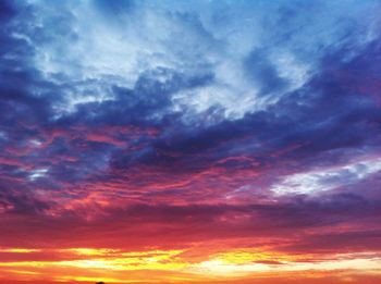 Low angle view of dramatic sky during sunset