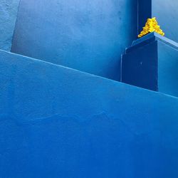 High angle view of blue wall by swimming pool