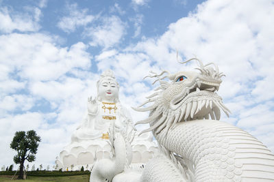 Low angle view of statue against sky