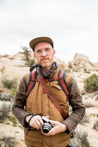 Portrait of man standing outdoors