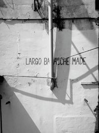 Close-up of text on wall