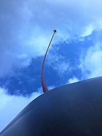 Airplane wing against sky