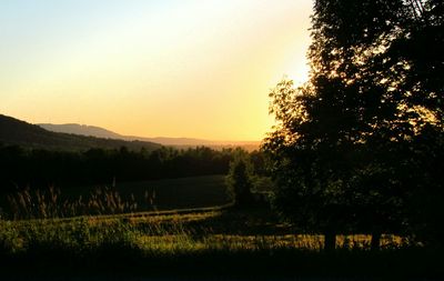 Scenic view of landscape against sky at sunset