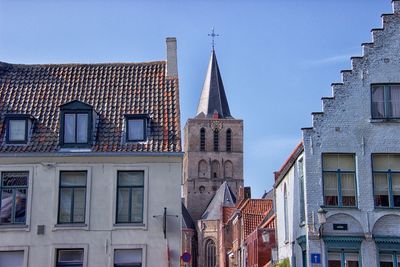 Low angle view of buildings in city against sky