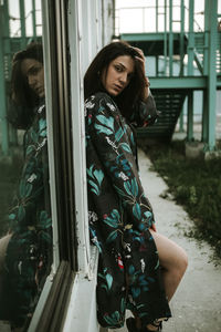 Portrait of young woman looking at camera