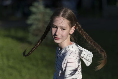 Portrait of girl standing outdoors