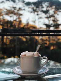 Close-up of coffee cup on table