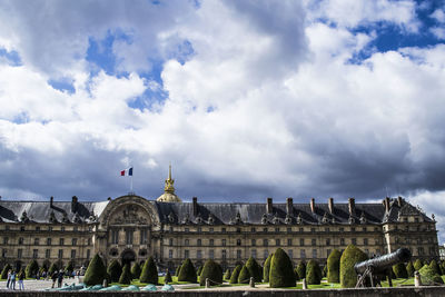 Low angle view of historical building against cloudy sky