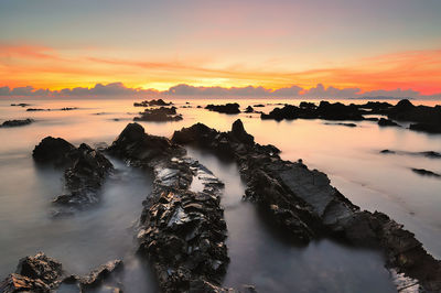 Scenic view of sea against sky during sunset