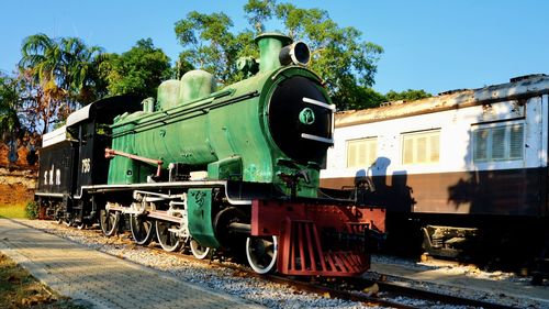 Train on railroad track against sky