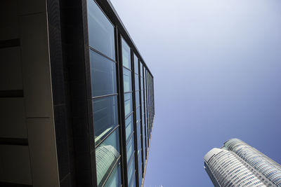 Low angle view of modern buildings against clear sky