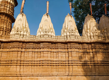 Low angle view of temple against building