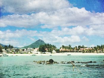 Scenic view of sea against cloudy sky