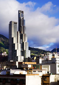 Modern buildings in city against sky