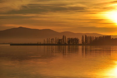 Scenic view of sea against sky during sunset