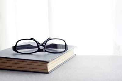 Close-up of eyeglasses on table