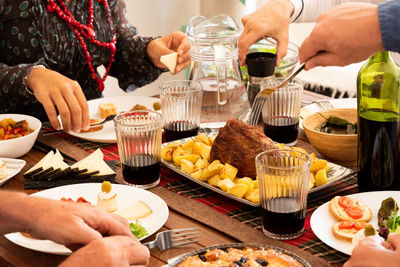 Cropped image of people eating in restaurant