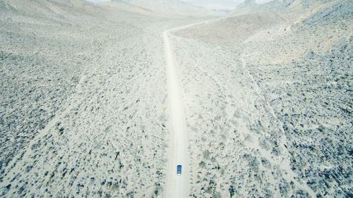 Aerial view of car moving on road at red rock canyon national conservation area