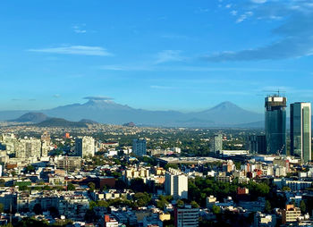 High angle view of buildings against sky in city