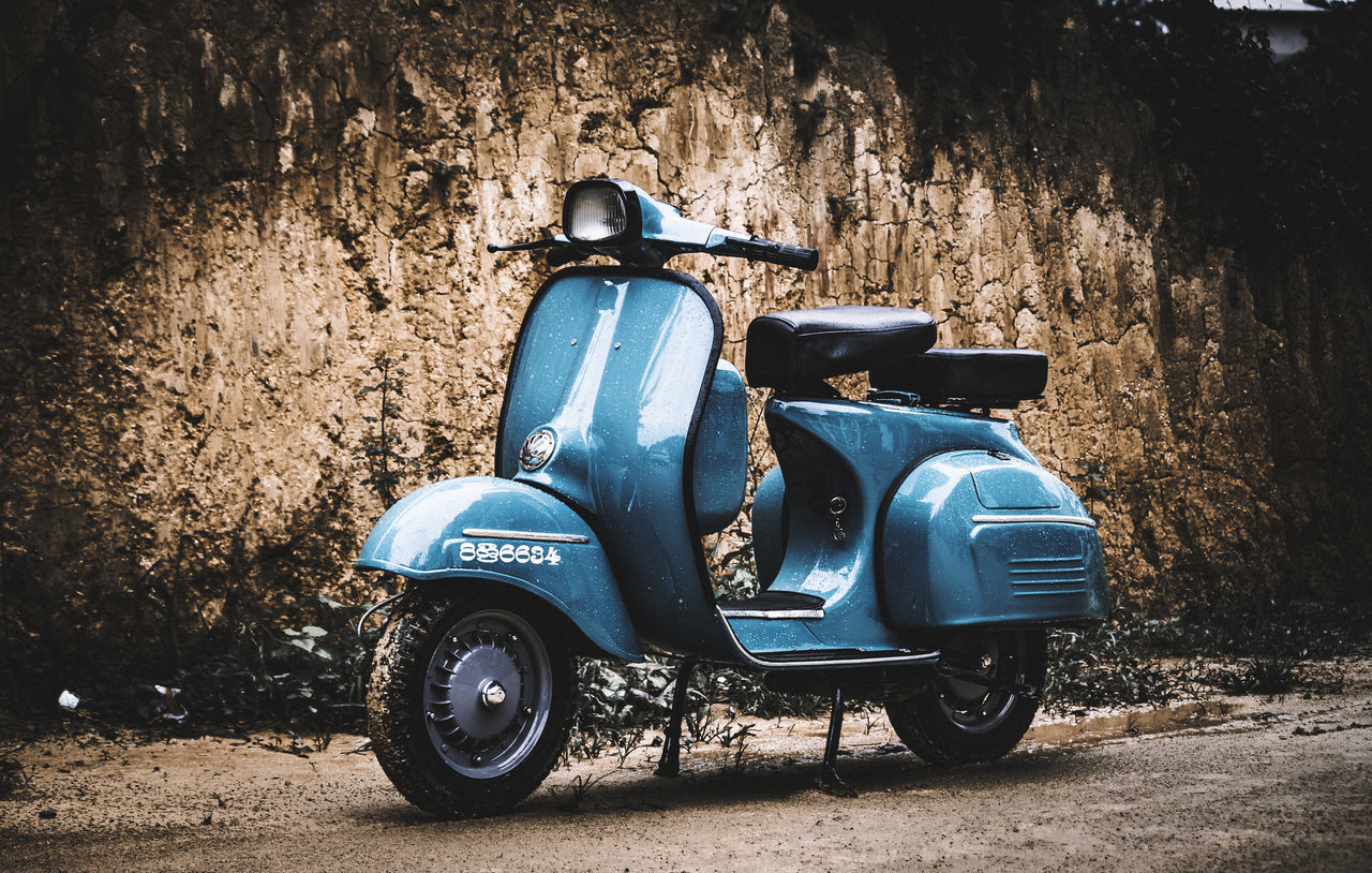 MOTORCYCLE PARKED AGAINST WALL